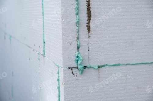 Preview: Installation of styrofoam insulation sheets on house facade wall for thermal protection.