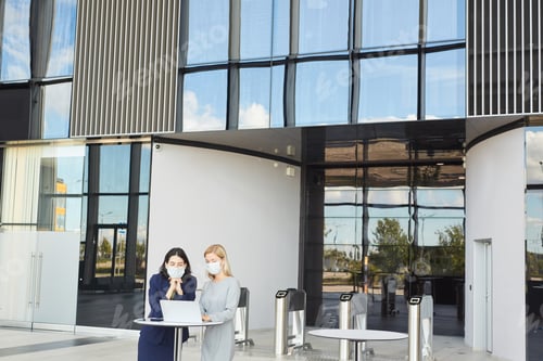 Preview: Office Building Background with Businesswomen Wearing Masks