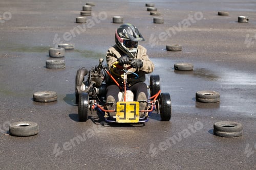 Preview: Karting - driver in helmet on kart circuit