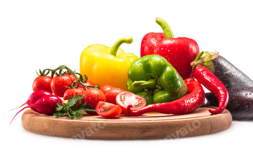 Preview: cherry tomatoes, different peppers and radish on wooden cutting board, isolated on white