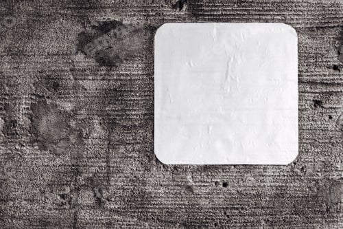 Preview: One Empty Swhite Leaf Of Paper Or Clean Sticker Closeup On An Old Concrete Wall For A Background