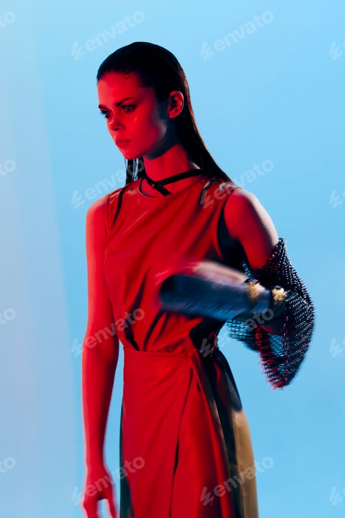 Preview: photo pretty woman in dress arm in armor chain mail protection blue background