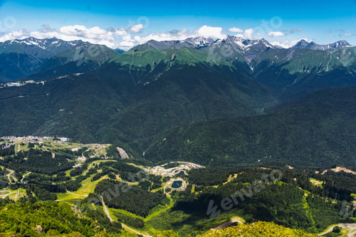Preview: Beautiful mountains landscape. Green tops, valleys and clouds in blue sky