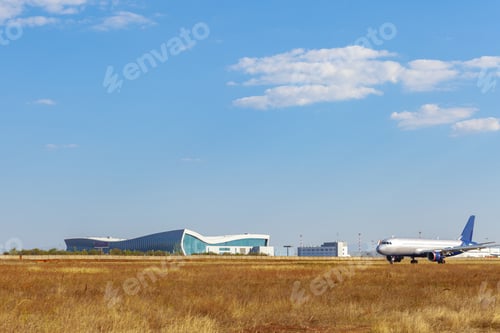 Preview: Passenger plane taking off from runway at airport on sunny day