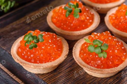 Preview: Delicious fresh red caviar on a dark concrete table