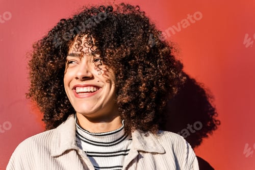 Preview: smiling black woman on a red background
