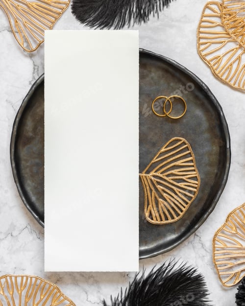 Preview: Black and golden wedding table setting with a blank card and rings top view, mockup