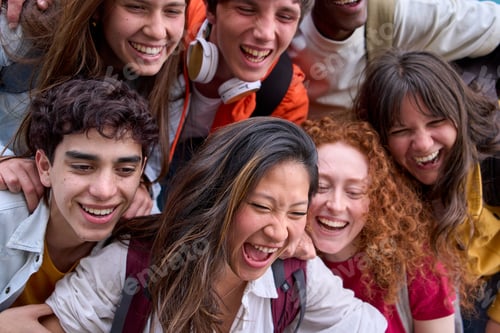 Preview: Close up of happy excited group of multi-ethnic college students hugging together. Generation z.