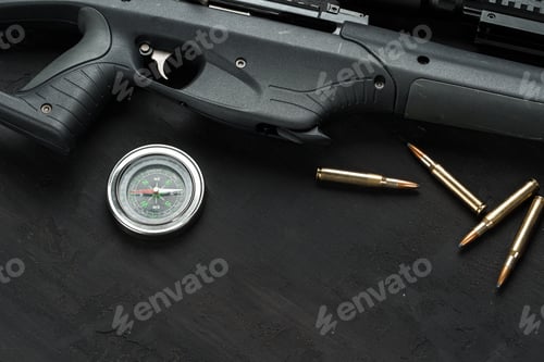 Preview: Hunting rifle and cartridges on dark wooden background