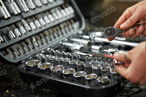Preview: Man hand open set box with working tools