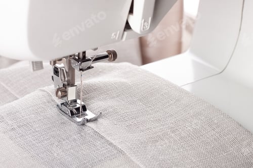 Preview: Modern Sewing Machine Presser Foot With Linen Fabric And Thread, Closeup