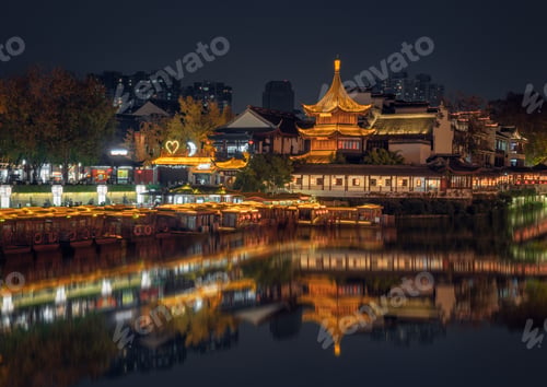 Preview: the view of the city skyline from a water way at night