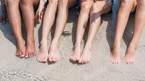 Preview: Close up leg children at beach. Teen playing, laughing and enjoying with friends at the sea.