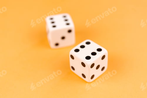 Preview: Two dices on orange background, top vew