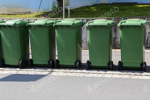 Preview: Lot of green garbage cans on the street