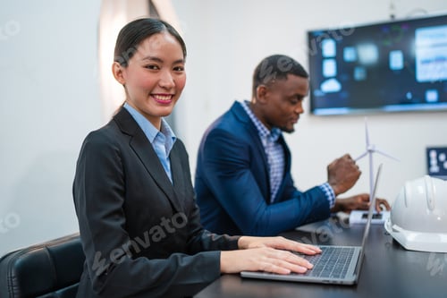 Preview: Successful businesswoman working at her office desk.