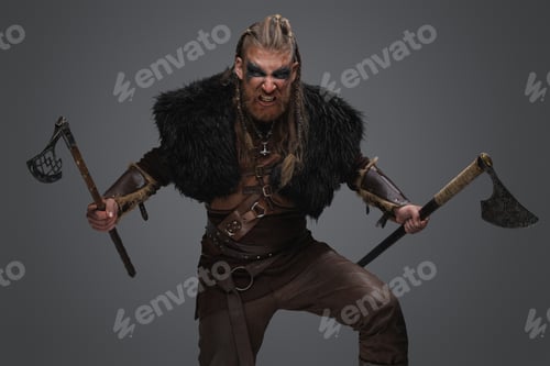 Preview: Violent scandinavian warrior with paired axes against gray background