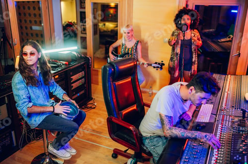 Preview: Band in a recording session in a music studio.