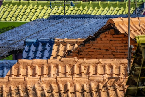 Preview: High angle shot of the colorful roofs of old houses in a suburban district