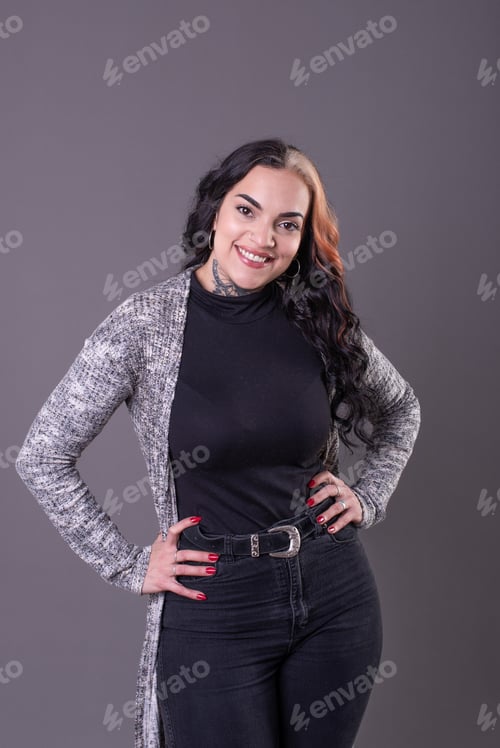 Preview: Beautiful woman posing with hands on waist.
