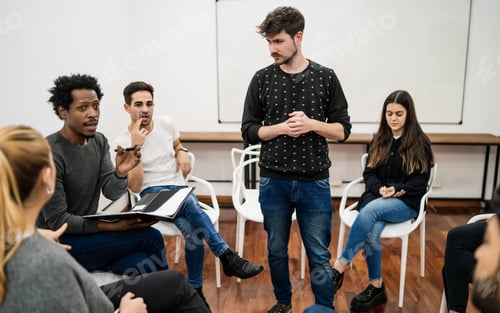 Preview: Manager leading a brainstorming meeting.