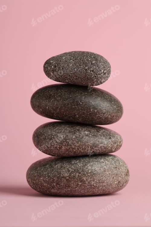 Preview: Stack of rocks on pink background. Harmony and life balance