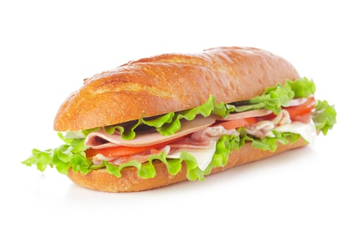 Preview: Fresh sandwich with lettuce, tomato, and sliced meats on a white background