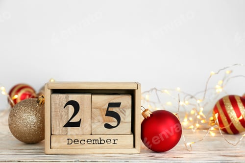 Preview: Wooden block calendar and decor on table. Christmas countdown