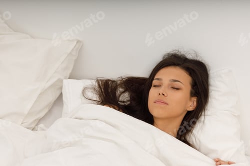 Preview: Healthy young woman covering white blanket sleep in bed at bedroom