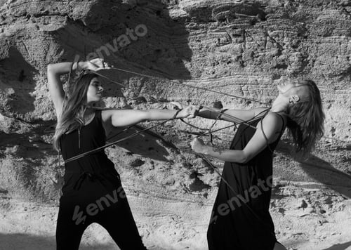 Preview: Women with textile dancing near stones