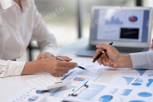 Preview: Business people analyzes, graphs and charts to examine and analyze company finances, revenues and bu