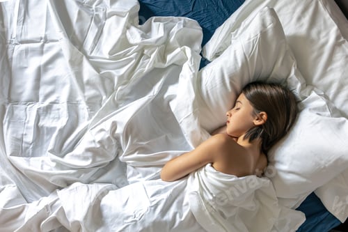 Preview: Sleeping girl in blanket. White bedding. Calm morning