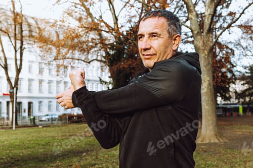 Preview: Caucasian elderly man exercising in park