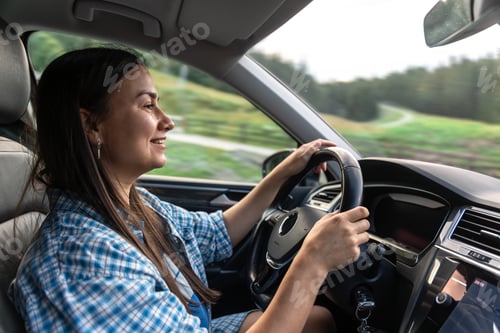 Preview: Woman driving on a green road. Free car journey