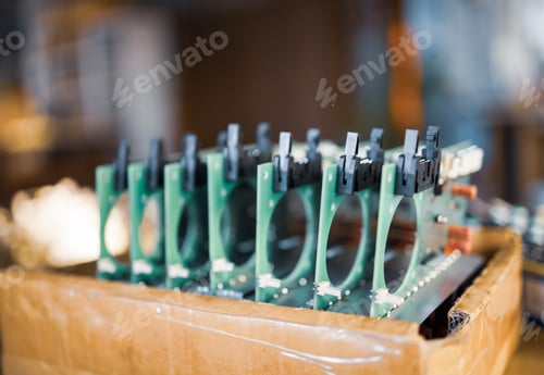 Preview: Close-up electric green embedded microcircuits in production