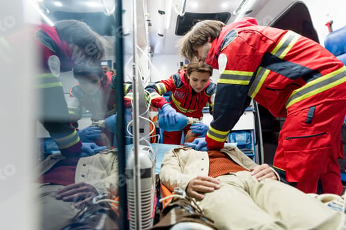 Preview: Paramedics doing cardiopulmonary resuscitation in ambulance car