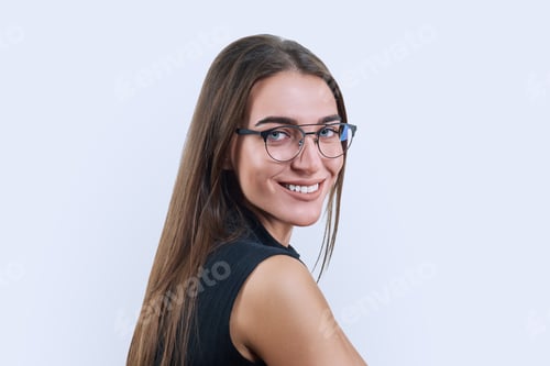 Preview: Headshot portrait of young woman in trendy glasses on white background