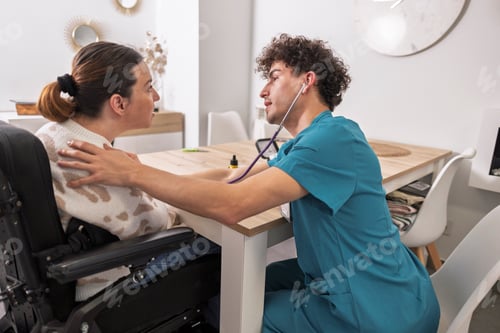 Preview: Doctor examining disabled woman during home visit consulting