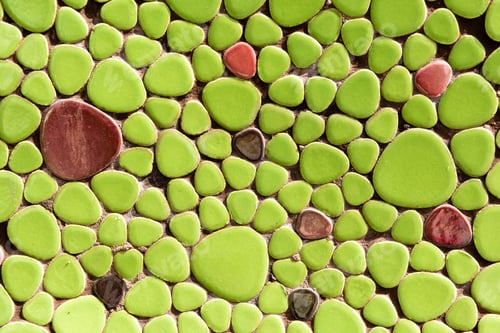 Preview: close-up view of beautiful decorative green and maroon stones, creative background