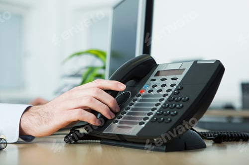 Preview: Office worker answering telephone