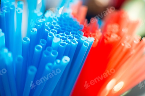 Preview: Plastic straws in red and blue colors. Plastic tubes.
