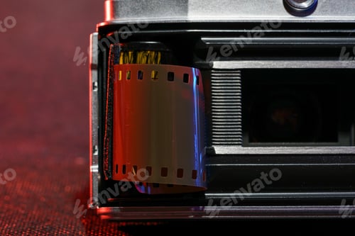 Preview: Analog camera with film roll on colorful background