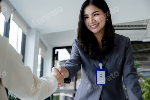 Preview: business team Shake hands after meeting to plan strategies increase business income