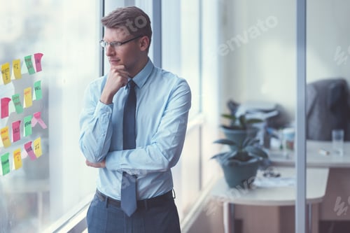 Preview: Young businessman by the window