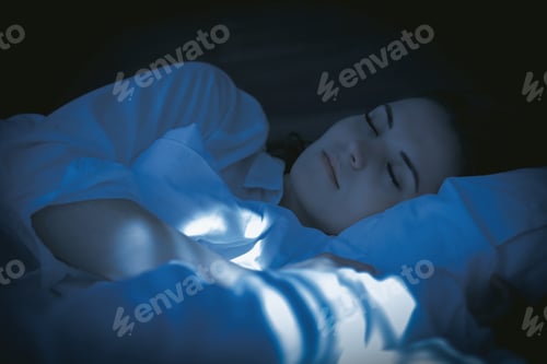 Preview: Pretty woman in modern apartment peacefully sleeping at night