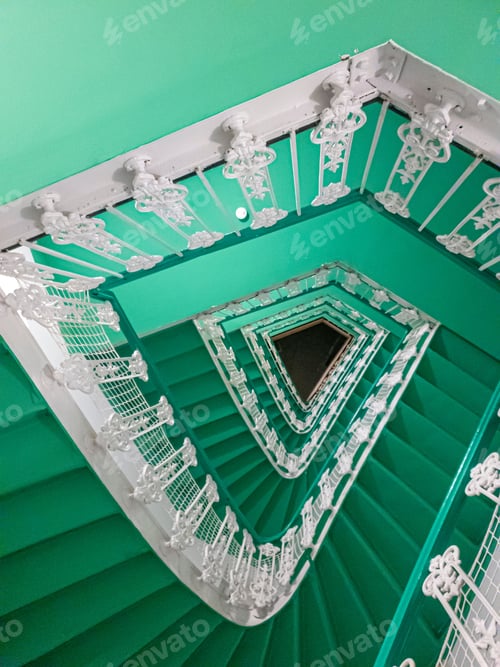 Preview: green staircase and white railing with green wall behind it and some decorations