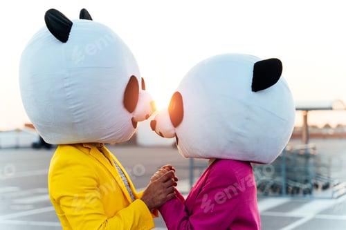 Preview: Storytelling image of a couple wearing giant panda head