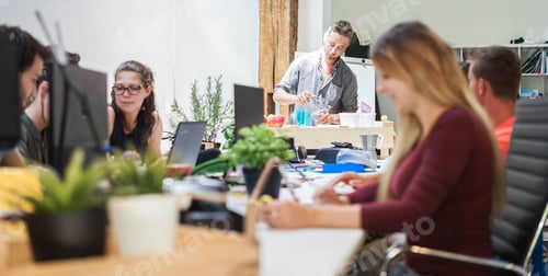 Preview: Young people working inside marketing agency office - Business and startup concept