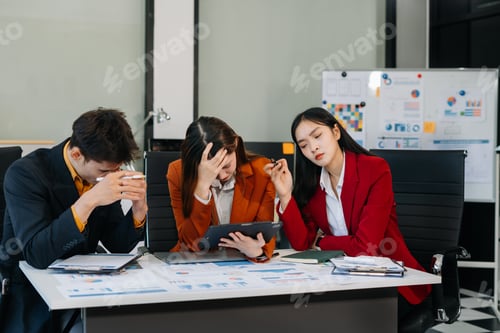 Preview: Businessman team working are under stress from financial data and report graph.