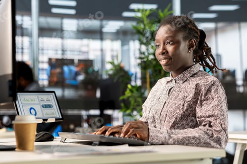 Preview: African american manager analyzing company data for strategic planning